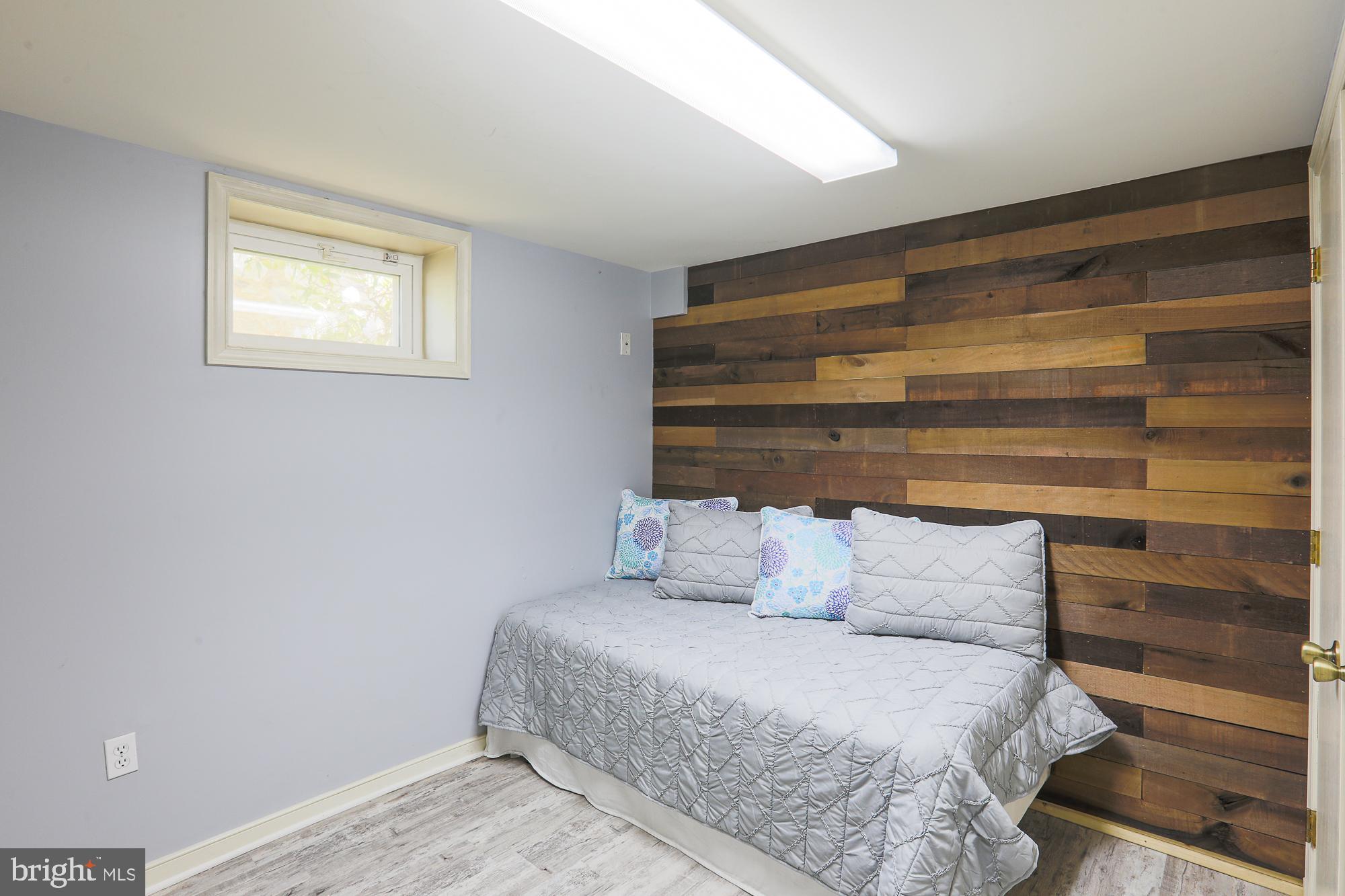 2509 Pinebrush Road Baltimore, MD 21209 - Photo 15 of 20 a bedroom with a bed and a window