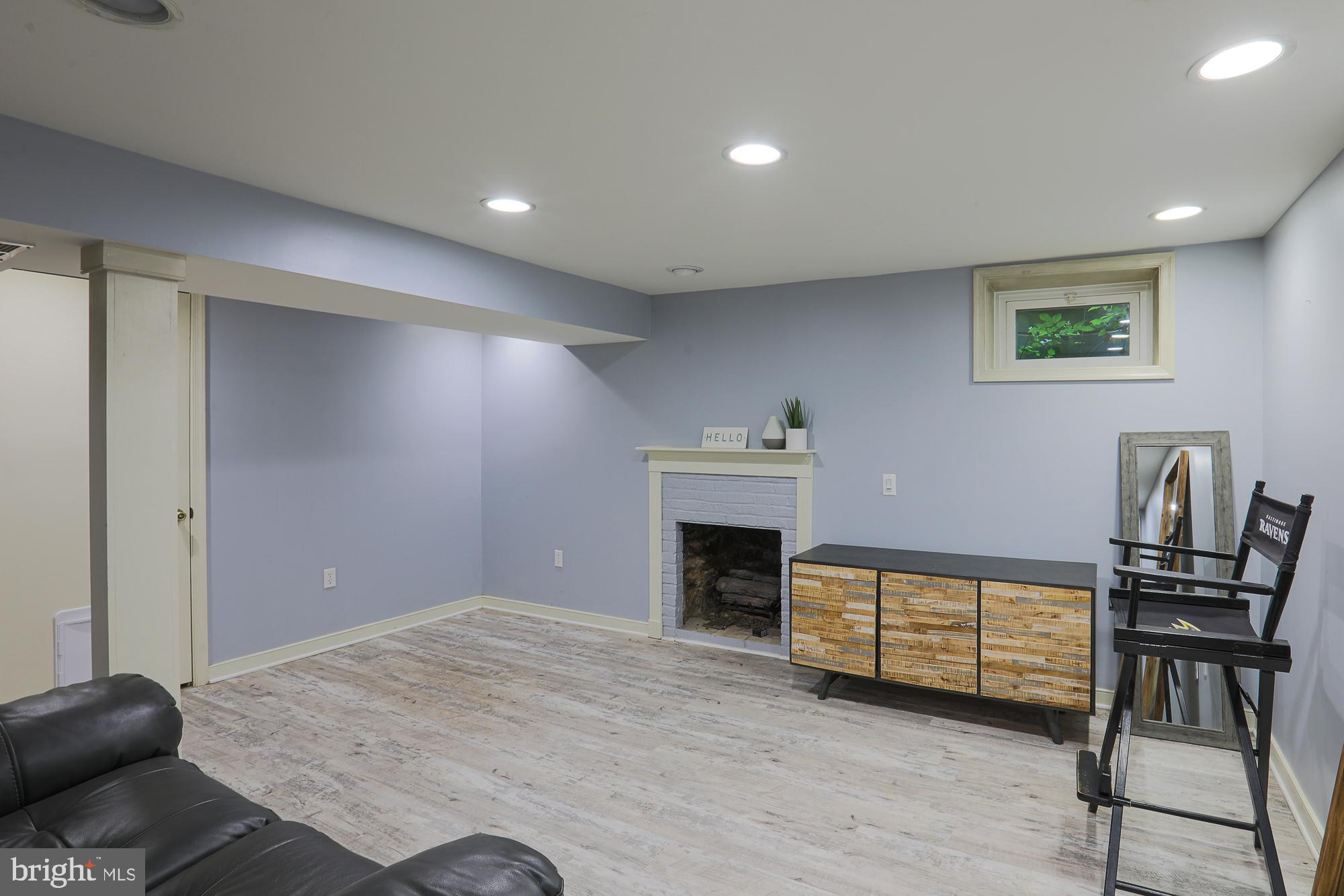 2509 Pinebrush Road Baltimore, MD 21209 - Photo 16 of 20 a view of a livingroom with furniture and a ceiling fan
