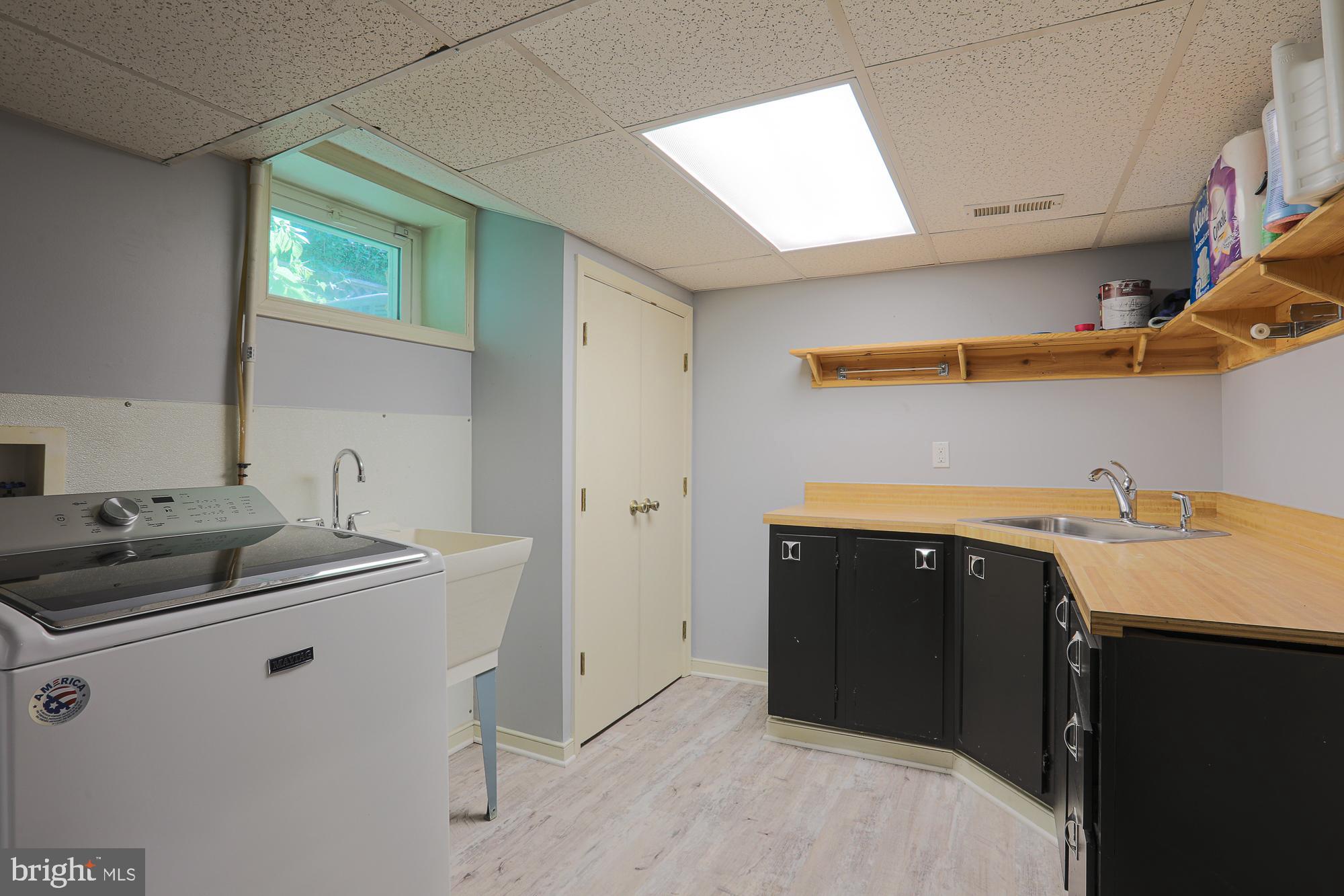 2509 Pinebrush Road Baltimore, MD 21209 - Photo 18 of 20 a utility room with cabinets washer and dryer