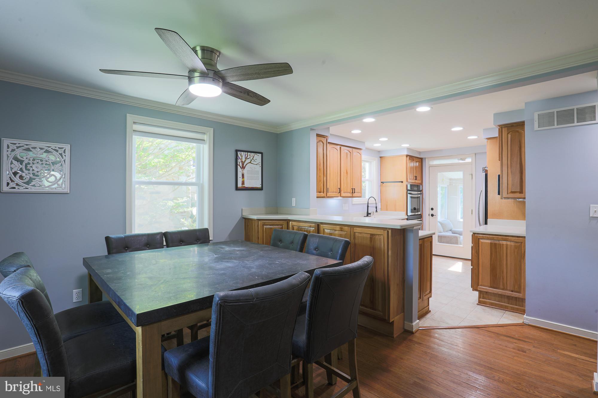 2509 Pinebrush Road Baltimore, MD 21209 - Photo 5 of 20 a view of a dining room with furniture and wooden floor