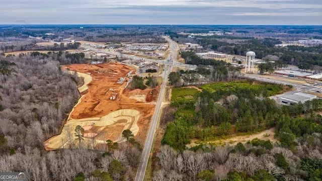 an aerial view of house with yard