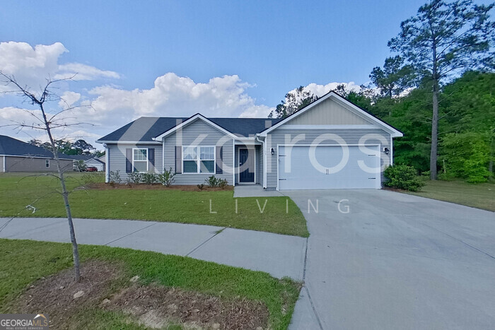 a front view of a house with a yard and porch