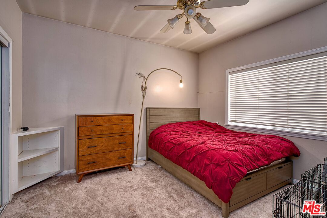 5565 Balcom Canyon Road Somis, CA 93066 - Photo 20 of 72 a bedroom with a bed and a chandelier