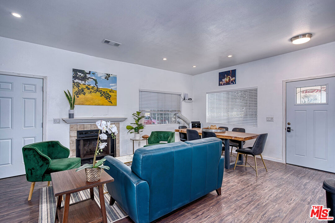 5565 Balcom Canyon Road Somis, CA 93066 - Photo 26 of 72 a living room with fireplace furniture and a wooden floor