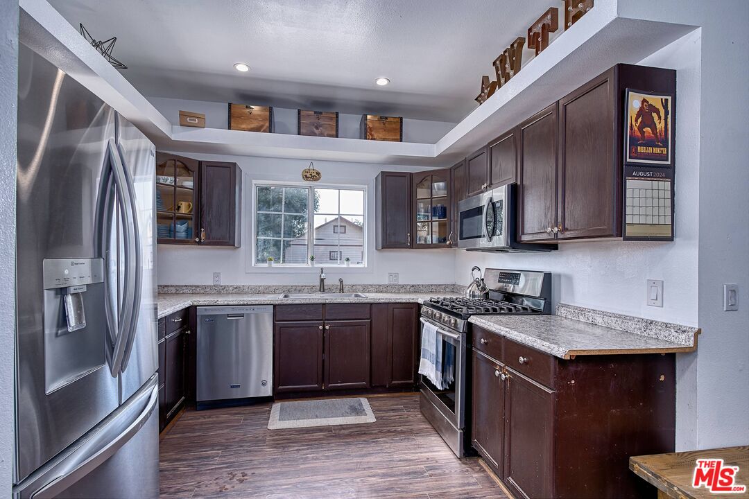 5565 Balcom Canyon Road Somis, CA 93066 - Photo 28 of 72 a kitchen with stainless steel appliances granite countertop a sink stove and refrigerator