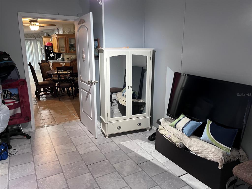 203 Vancouver Circle Interlachen, FL 32148 - Photo 18 of 25 a living room with furniture and a flat screen tv