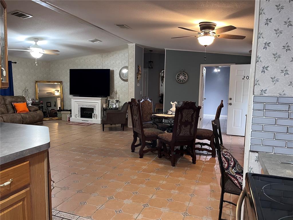 203 Vancouver Circle Interlachen, FL 32148 - Photo 19 of 25 a living room with furniture and a flat screen tv