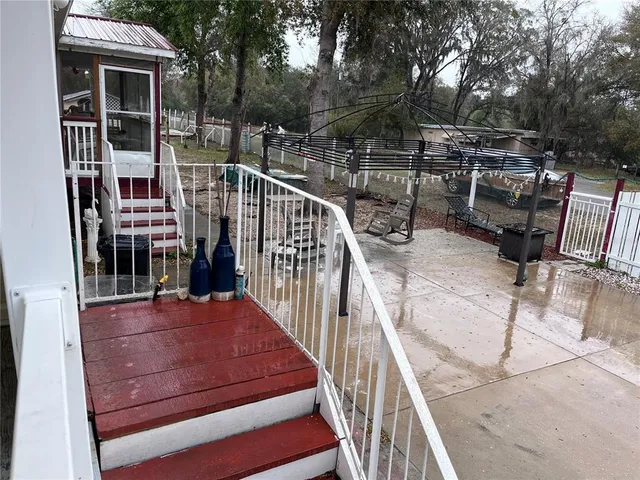 a view of a balcony with chairs