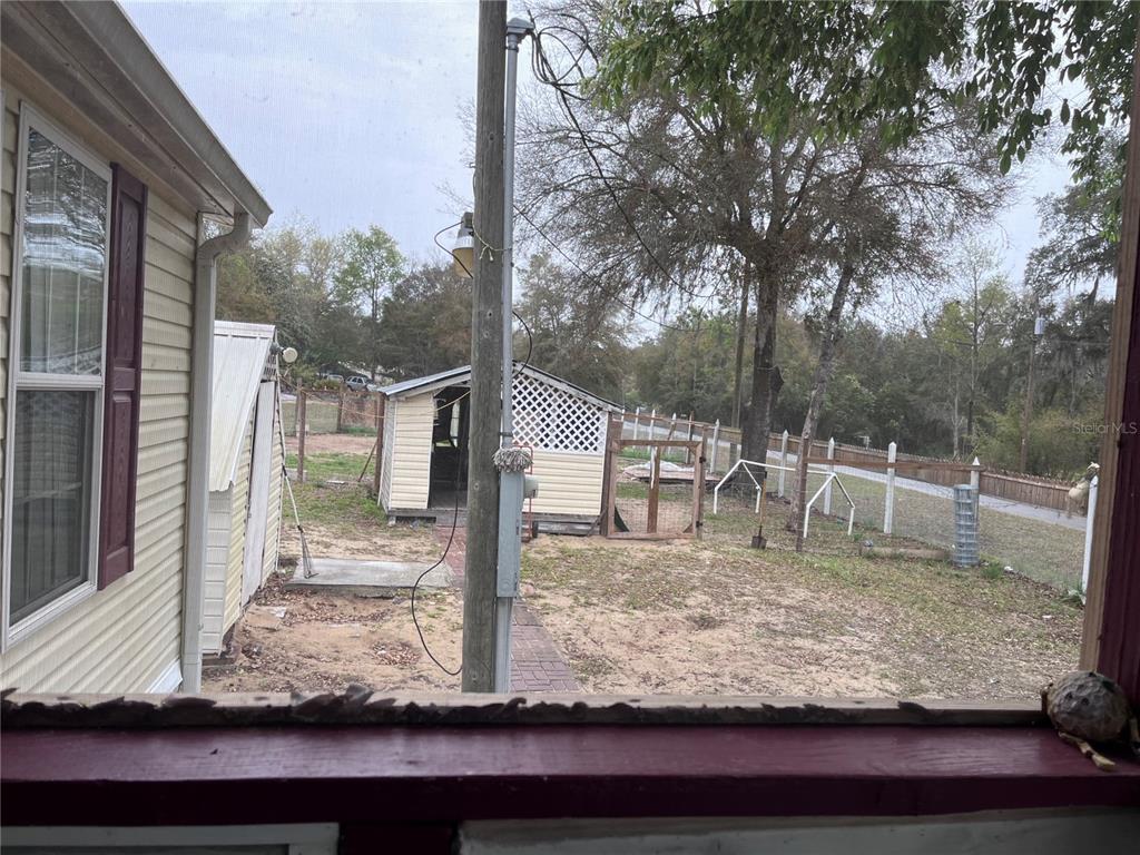 203 Vancouver Circle Interlachen, FL 32148 - Photo 6 of 25 a view of a yard with wooden fence