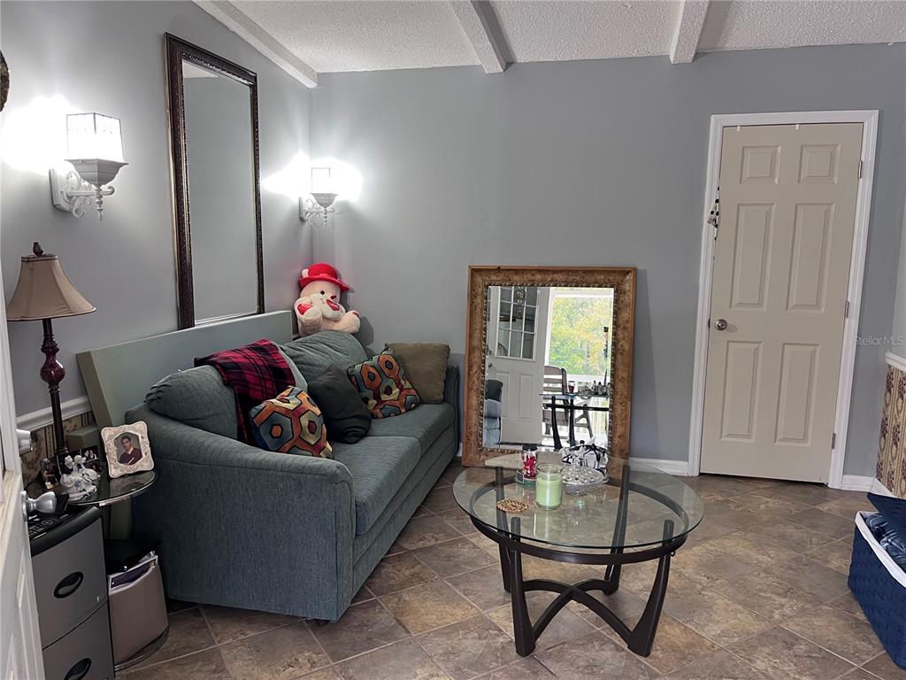 203 Vancouver Circle Interlachen, FL 32148 - Photo 8 of 25 a living room with furniture and a window