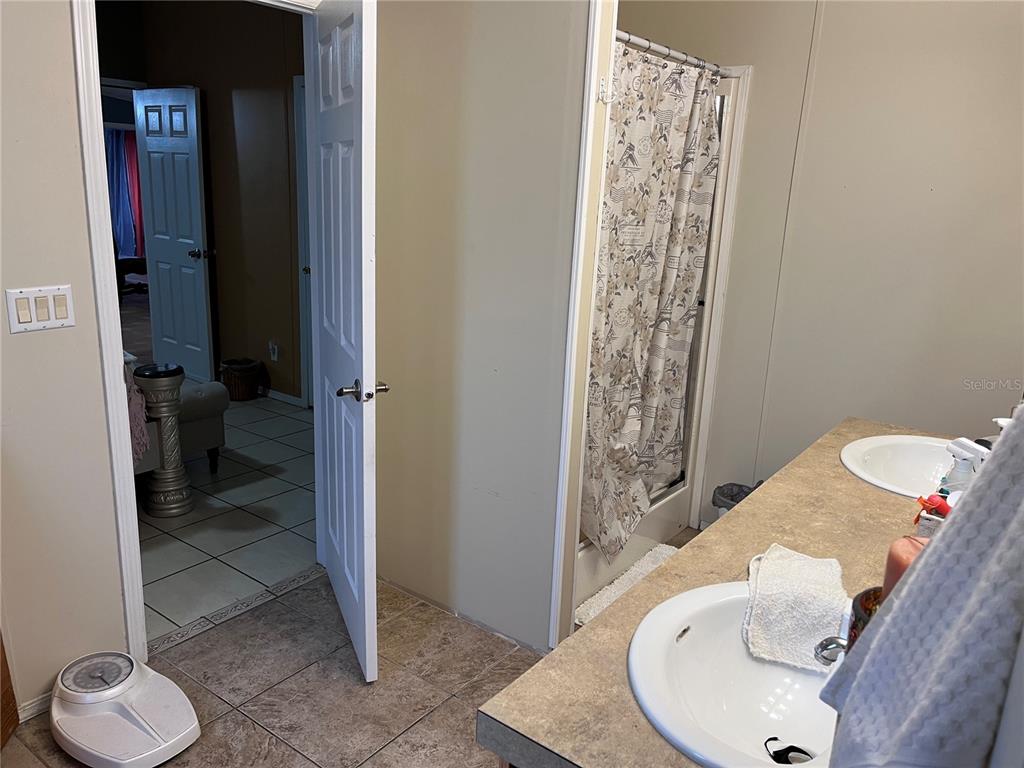 203 Vancouver Circle Interlachen, FL 32148 - Photo 9 of 25 a bathroom with a sink and toilet
