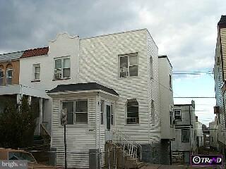 6925 Clinton Road Upper Darby, PA 19082 - Photo 1 of 1 a front view of a house with parking space
