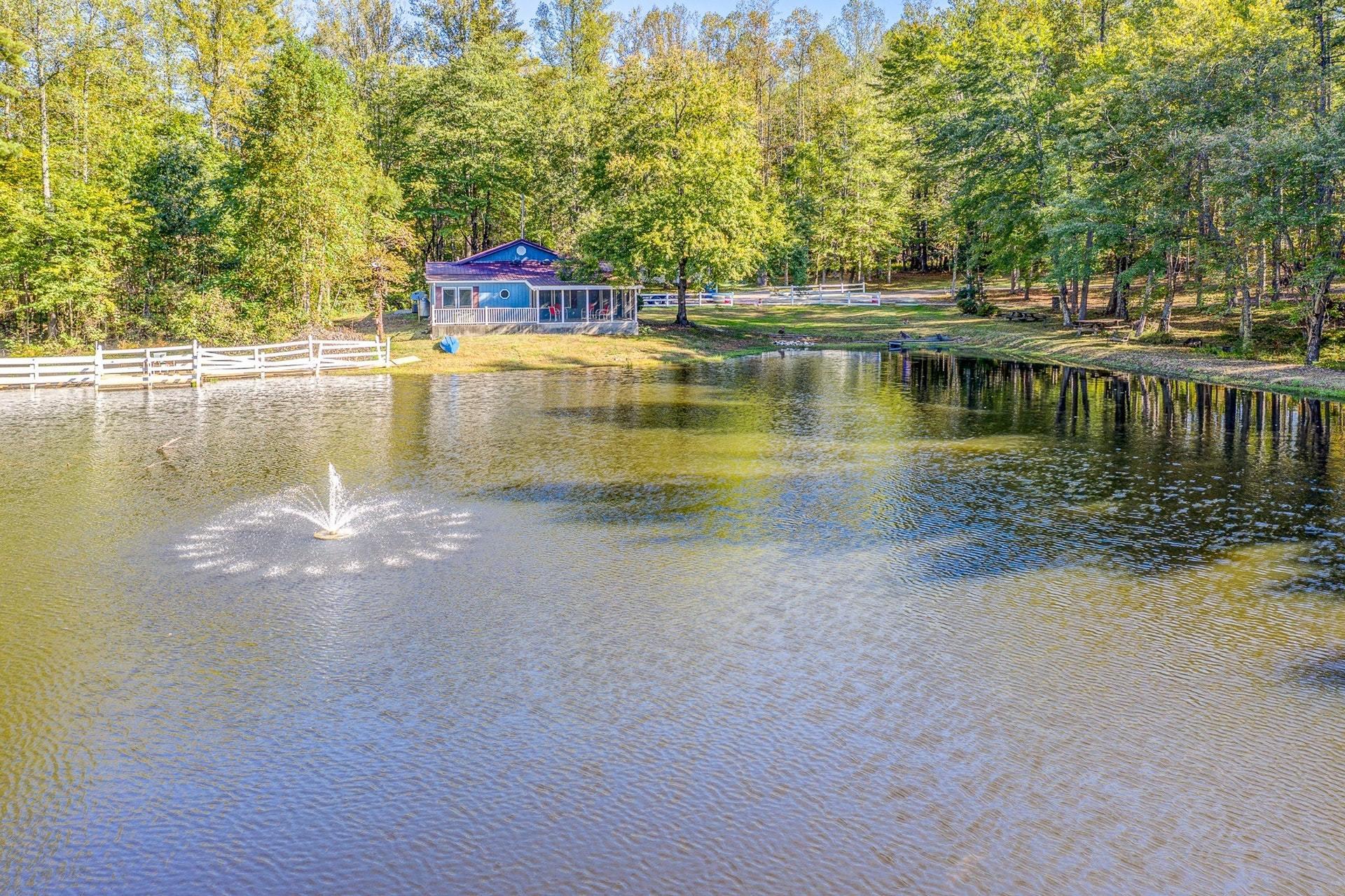 5028 Henry Road Henry, VA 24102 - Photo 2 of 44 a view of a lake with houses