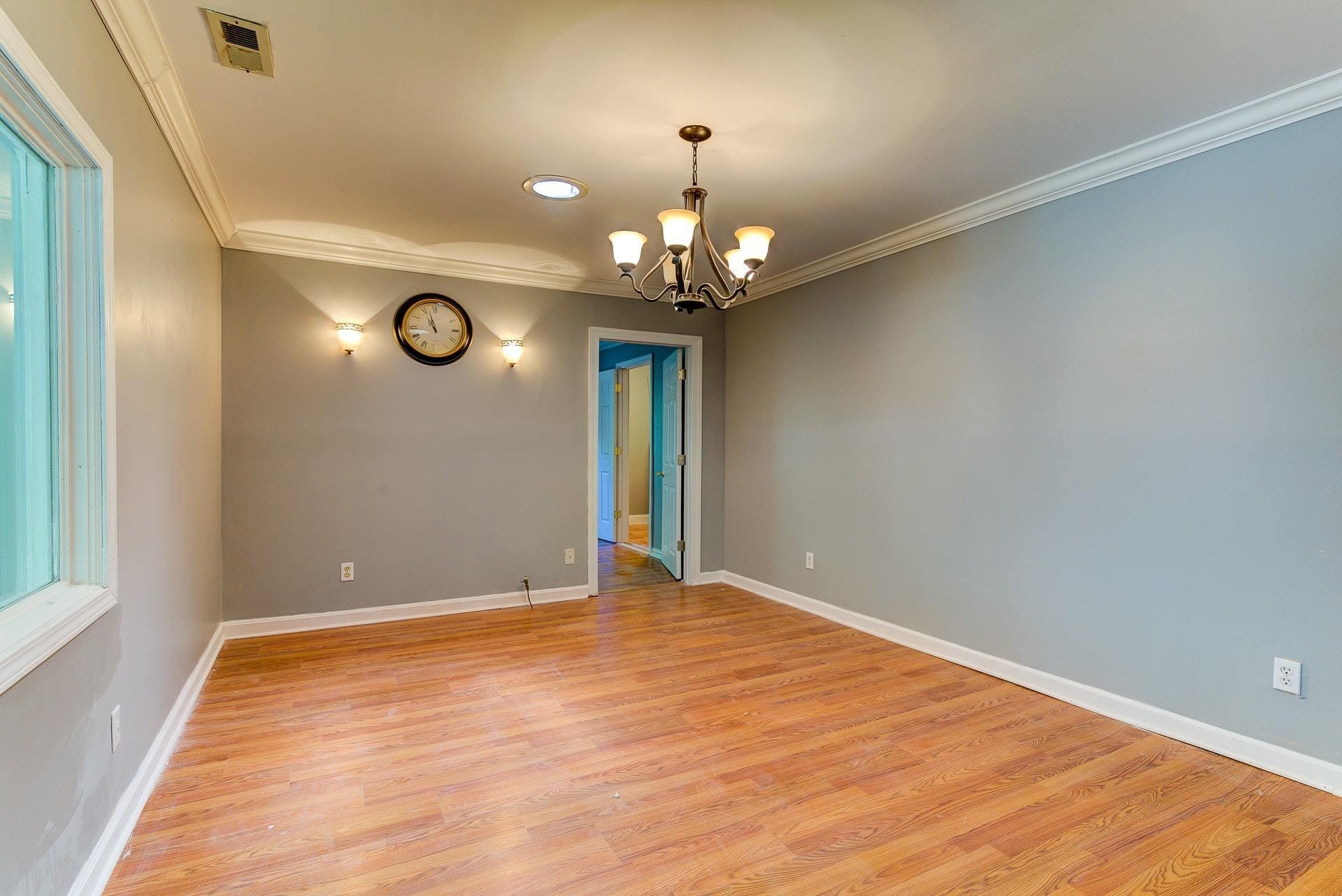 5028 Henry Road Henry, VA 24102 - Photo 21 of 44 a view of an empty room with a chandelier fan and a large window