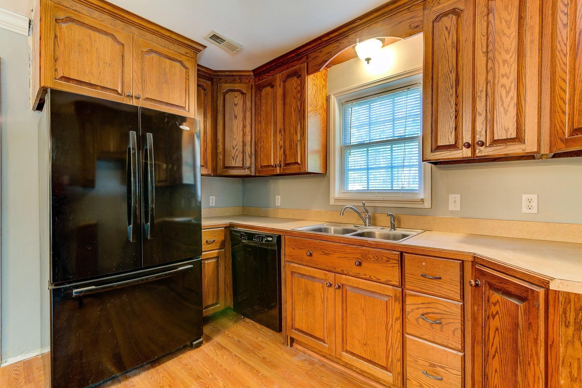 5028 Henry Road Henry, VA 24102 - Photo 22 of 44 a kitchen with stainless steel appliances granite countertop a refrigerator and a sink