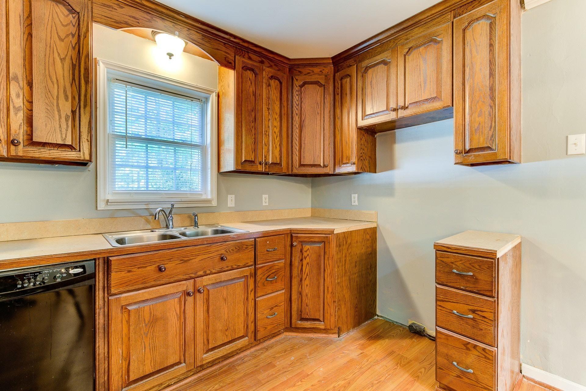 5028 Henry Road Henry, VA 24102 - Photo 23 of 44 a kitchen with stainless steel appliances granite countertop a sink stove and cabinets