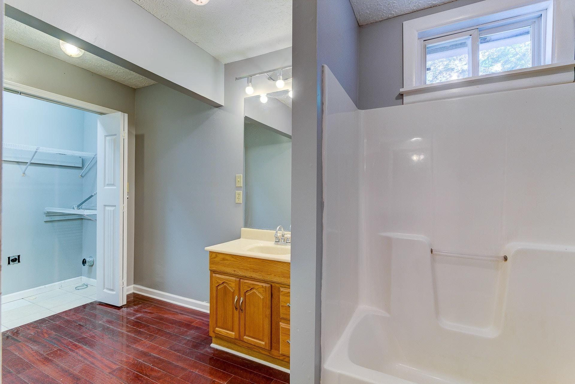 5028 Henry Road Henry, VA 24102 - Photo 26 of 44 a view of bathroom with bathtub and wooden floor