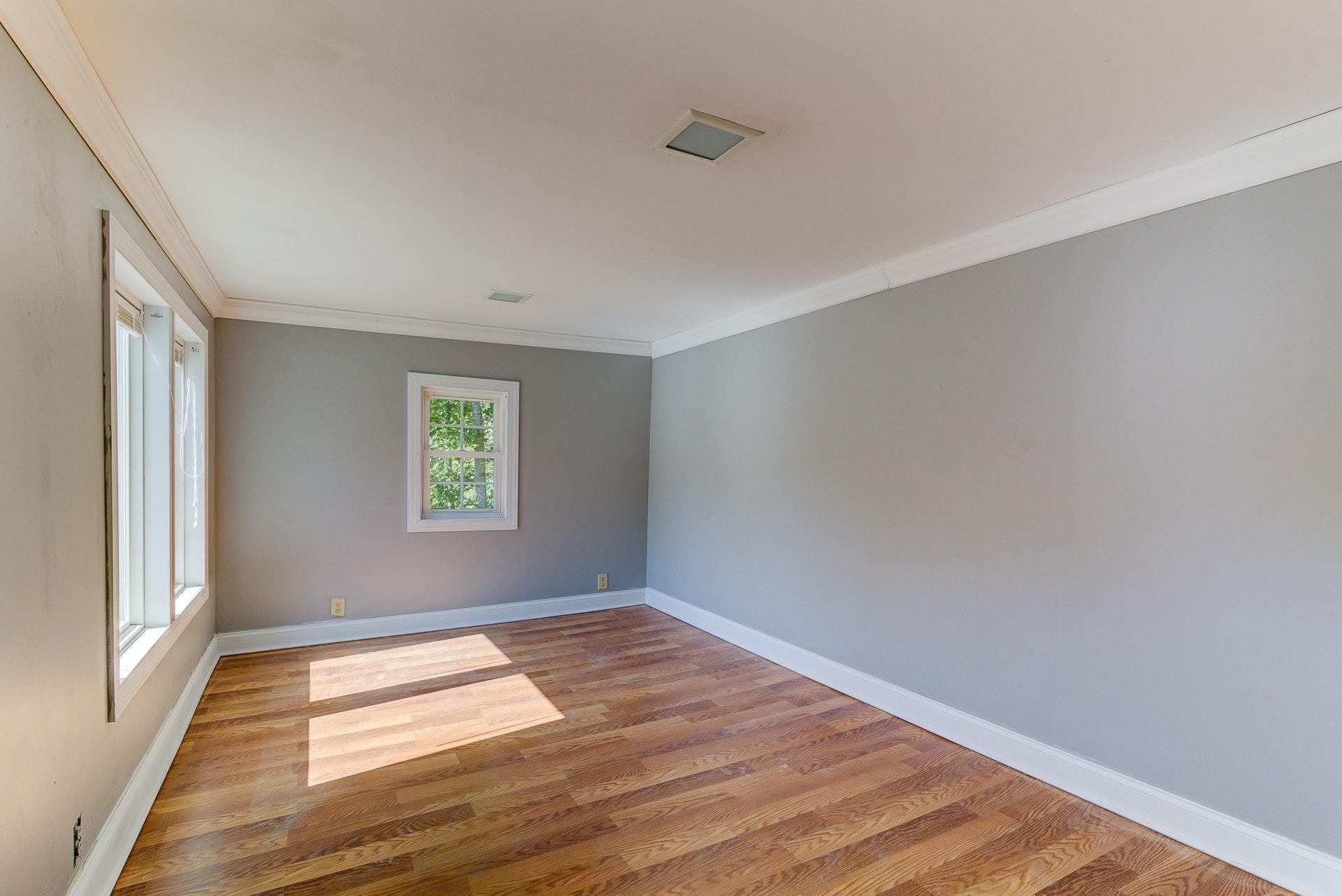 5028 Henry Road Henry, VA 24102 - Photo 27 of 44 a view of empty room with wooden floor and fan