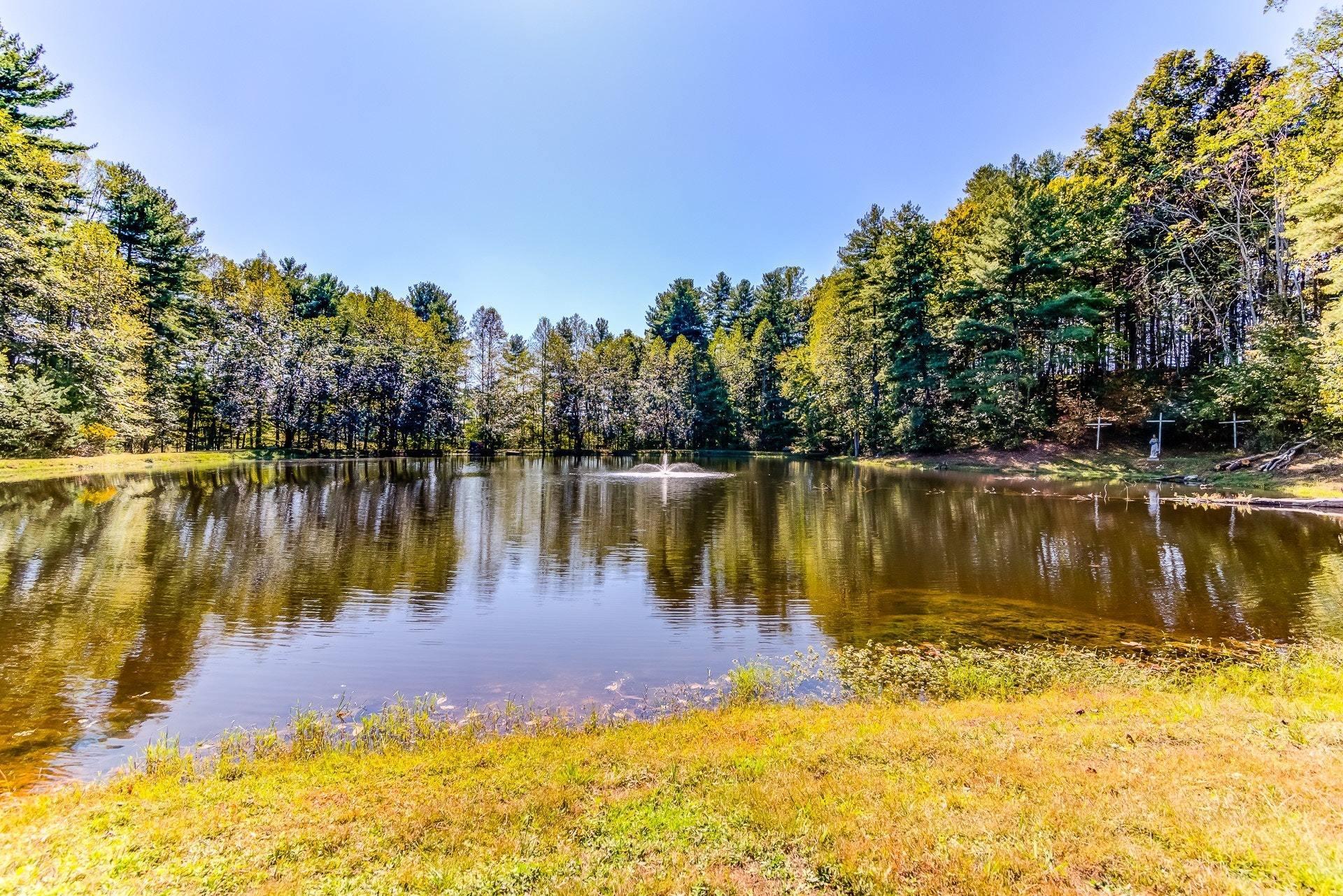 5028 Henry Road Henry, VA 24102 - Photo 35 of 44 a view of a lake with a trees in the background