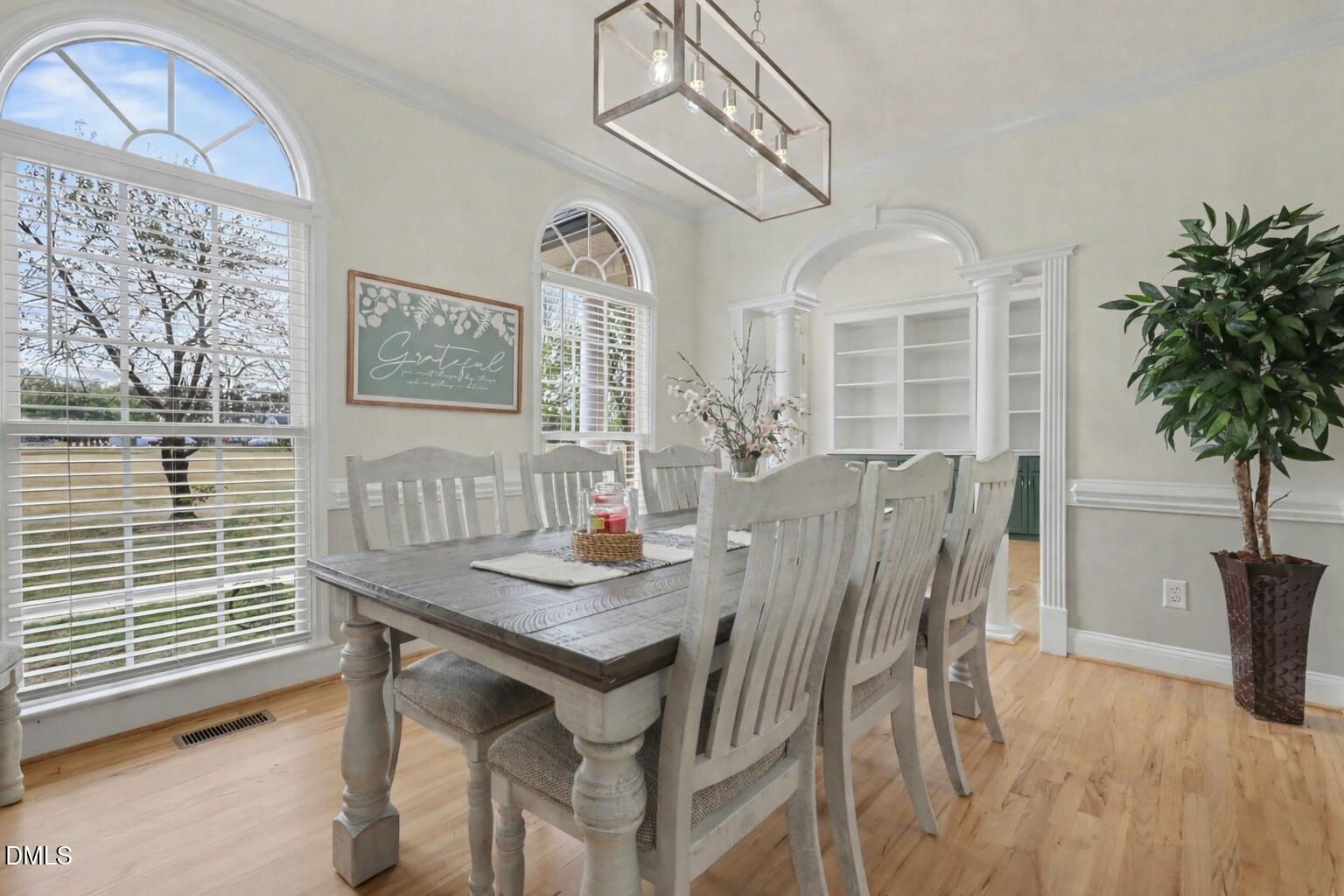 430 Fred Hall Road Stedman, NC 28391 - Photo 8 of 63 a view of a dining room with furniture and a chandelier