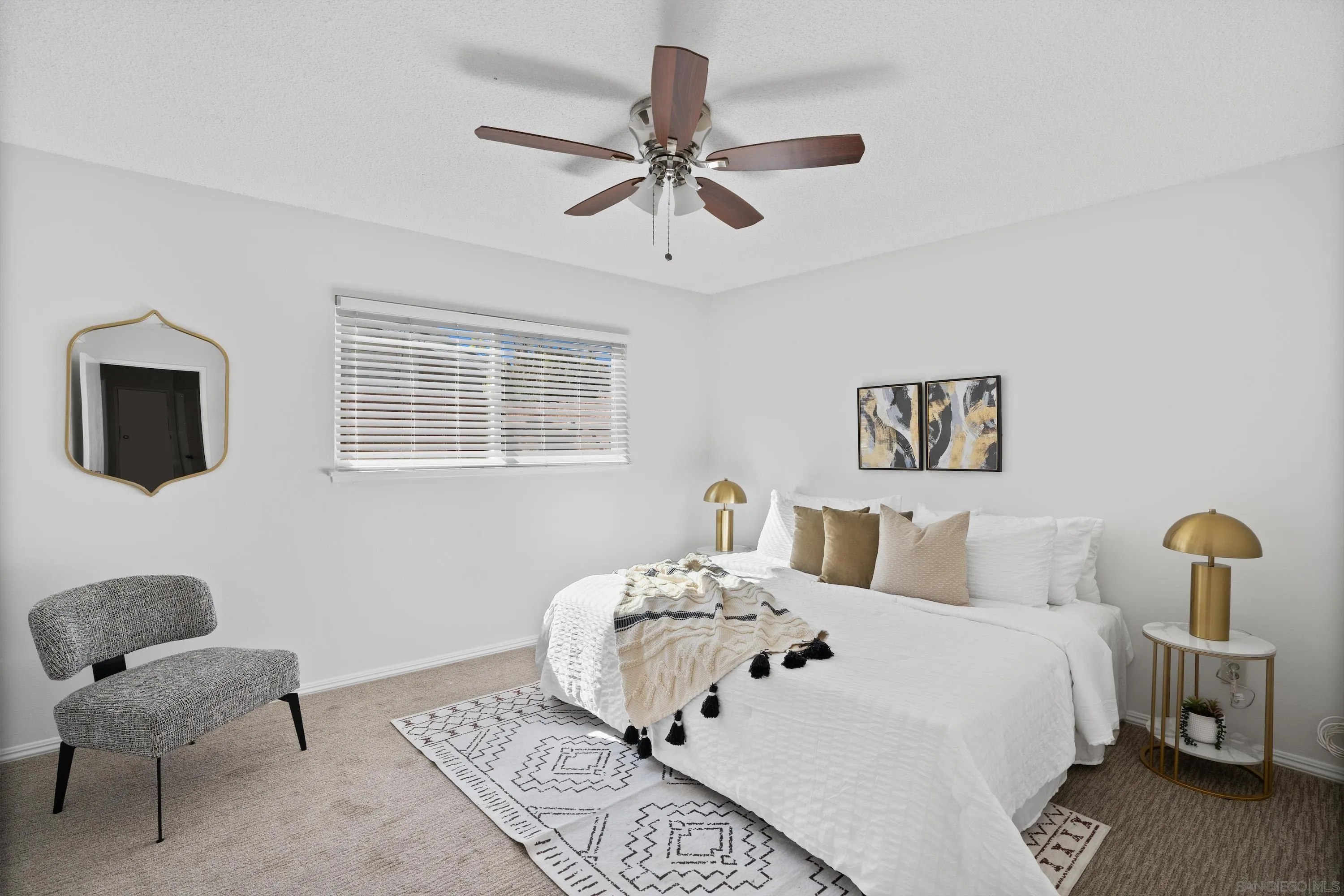 4390 Rolfe Road San Diego, CA 92117 - Photo 15 of 28 a bedroom with a bed and a chair