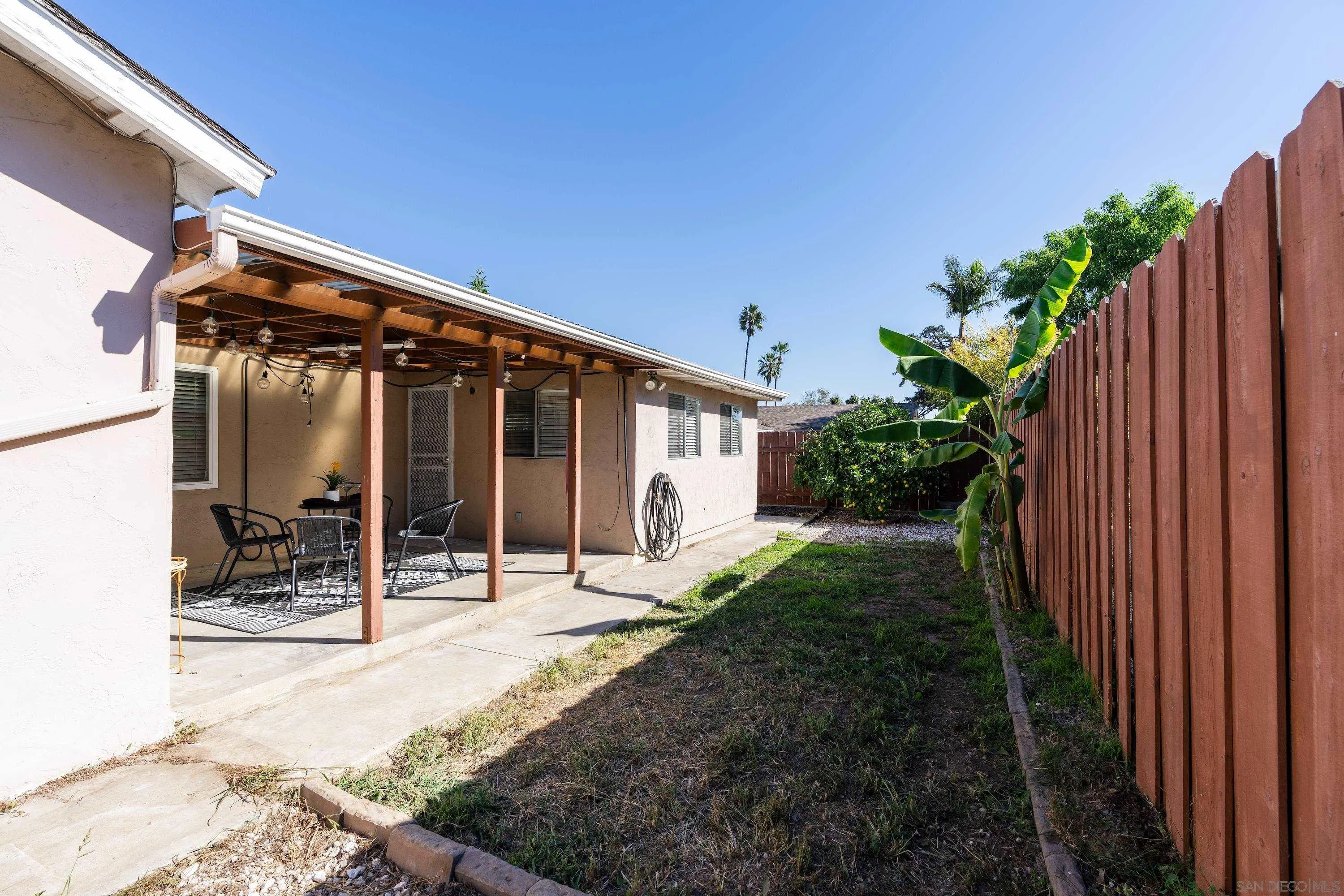 4390 Rolfe Road San Diego, CA 92117 - Photo 21 of 28 a view of a house with backyard and sitting area