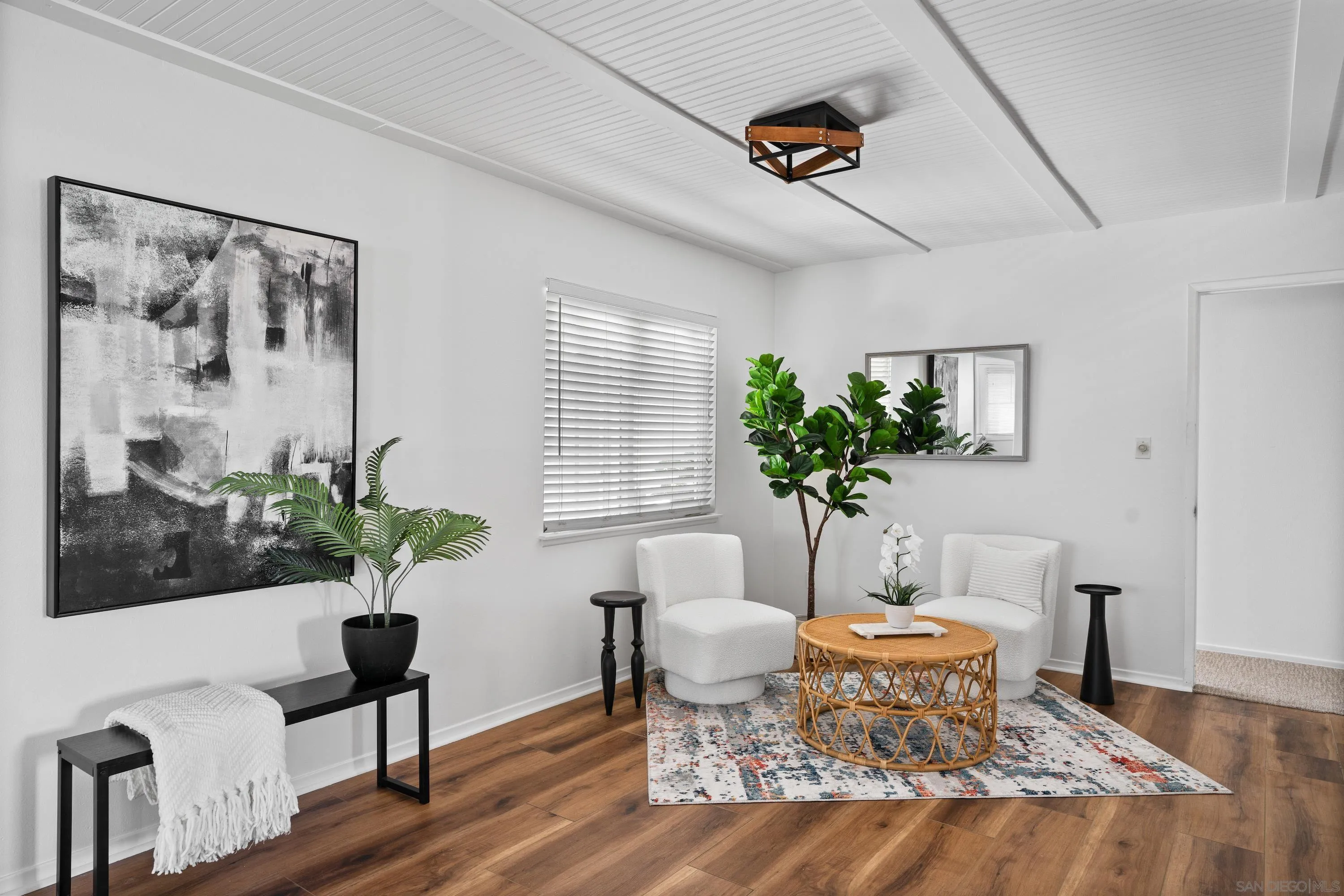 4390 Rolfe Road San Diego, CA 92117 - Photo 3 of 28 a living room with furniture potted plant and window