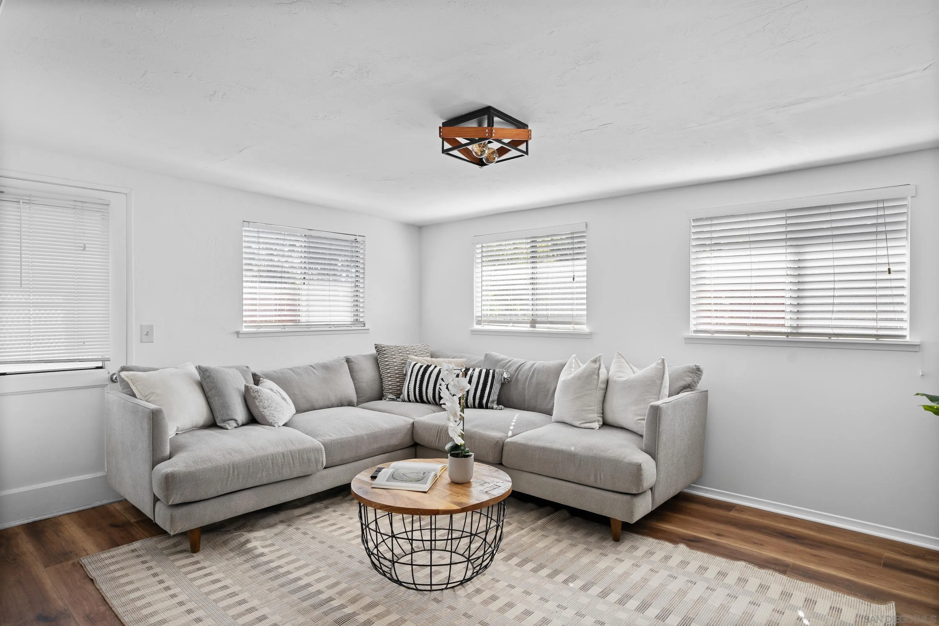 4390 Rolfe Road San Diego, CA 92117 - Photo 6 of 28 a living room with furniture and a window