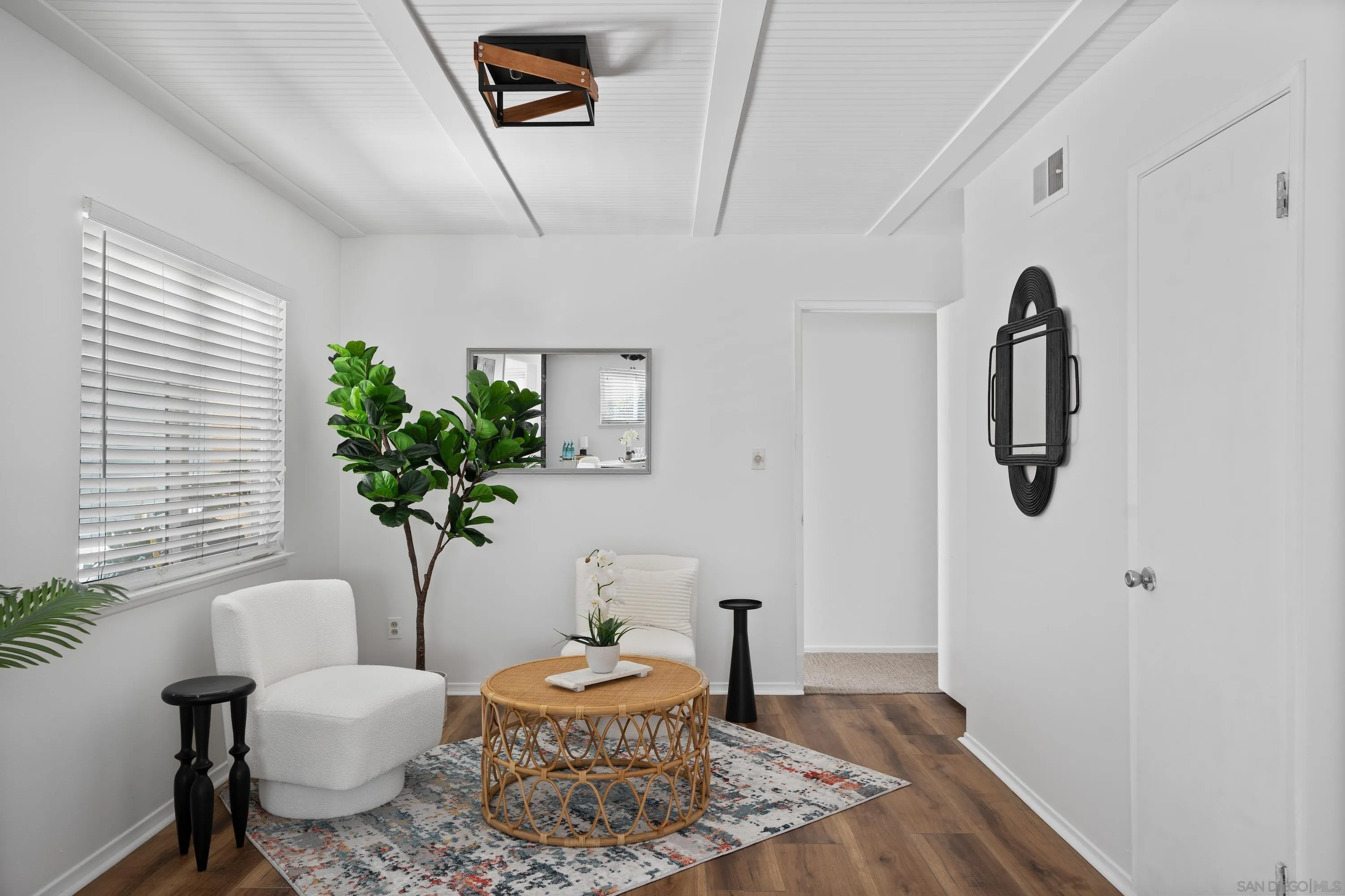 4390 Rolfe Road San Diego, CA 92117 - Photo 8 of 28 a living room with furniture and a potted plant