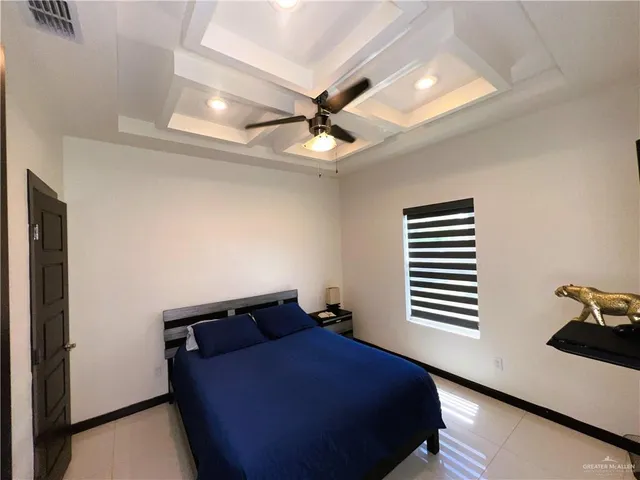 a bed room with a bed and a window