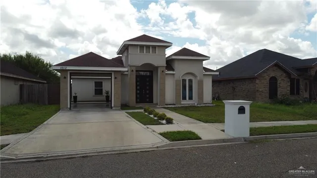 front view of a house with a yard