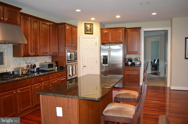10850 Nemrod Road Perry Hall, MD 21128 - Photo 1 of 25 a kitchen with stainless steel appliances granite countertop a refrigerator a sink and a stove