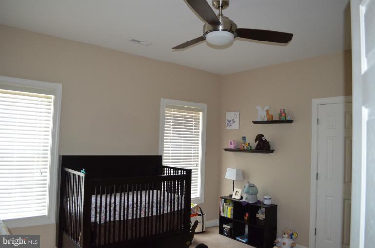 10850 Nemrod Road Perry Hall, MD 21128 - Photo 14 of 25 a view of a bedroom with furniture and windows