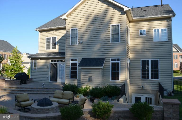 10850 Nemrod Road Perry Hall, MD 21128 - Photo 16 of 25 a view of a house with couches chairs and potted plants