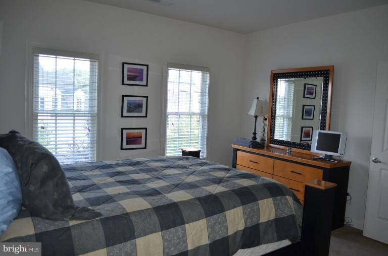 10850 Nemrod Road Perry Hall, MD 21128 - Photo 17 of 25 a bedroom with a bed and a windows