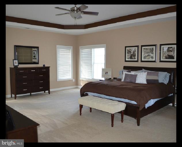10850 Nemrod Road Perry Hall, MD 21128 - Photo 19 of 25 a spacious bedroom with a bed and window