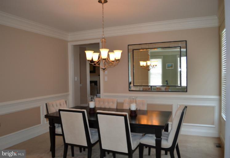 10850 Nemrod Road Perry Hall, MD 21128 - Photo 20 of 25 a view of a dining room with furniture and chandelier