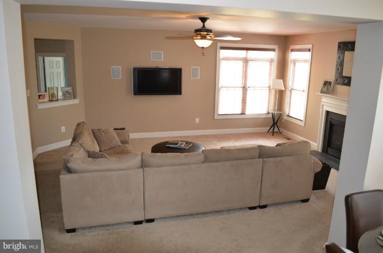 10850 Nemrod Road Perry Hall, MD 21128 - Photo 22 of 25 a living room with furniture and a flat screen tv