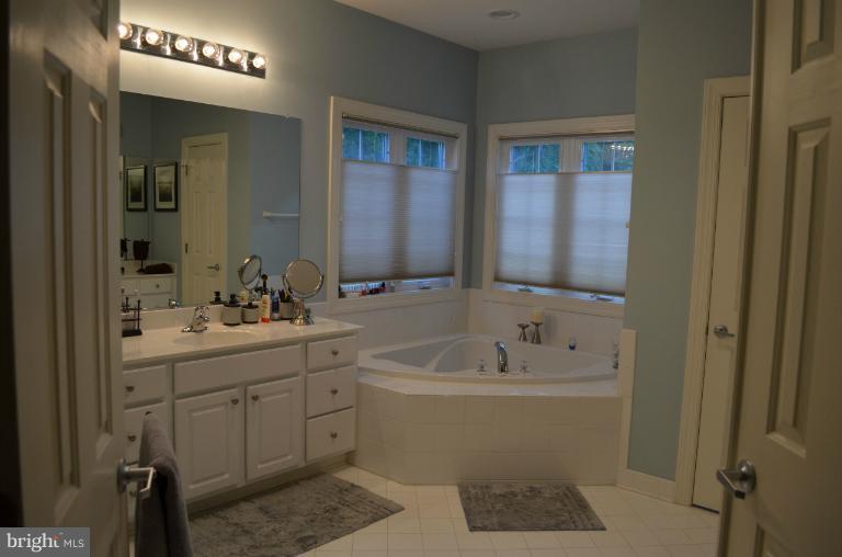10850 Nemrod Road Perry Hall, MD 21128 - Photo 23 of 25 a bathroom with a sink a toilet and shower