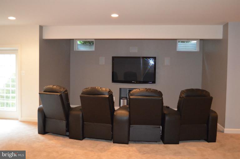 10850 Nemrod Road Perry Hall, MD 21128 - Photo 5 of 25 a living room with furniture and a flat screen tv