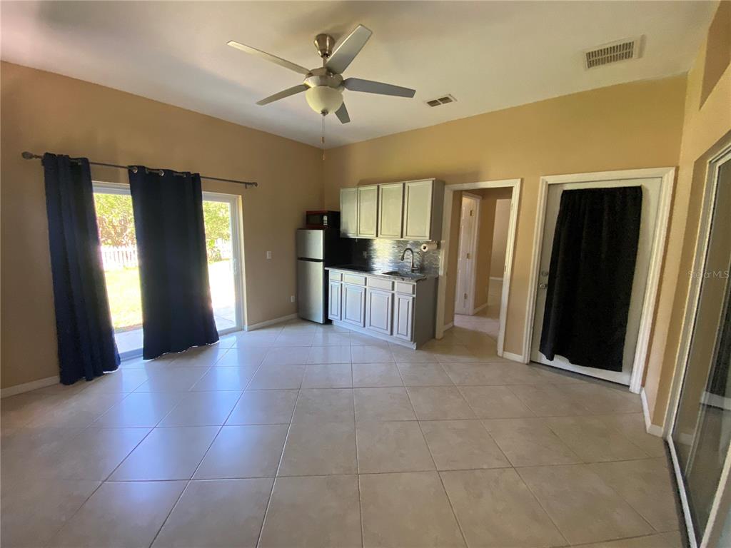 2467 Huron Circle Kissimmee, FL 34746 - Photo 19 of 26 a view of an empty room with a window