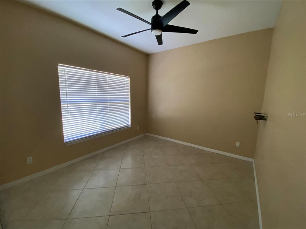 2467 Huron Circle Kissimmee, FL 34746 - Photo 21 of 26 a view of an empty room with a window