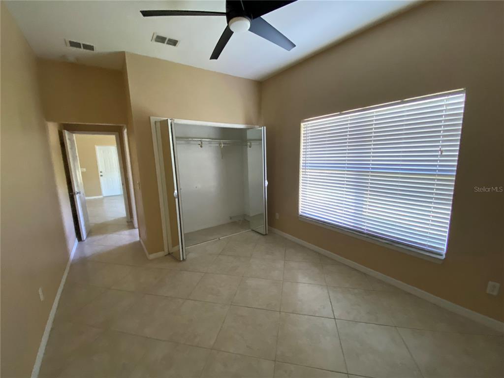 2467 Huron Circle Kissimmee, FL 34746 - Photo 22 of 26 a view of an empty room with a window