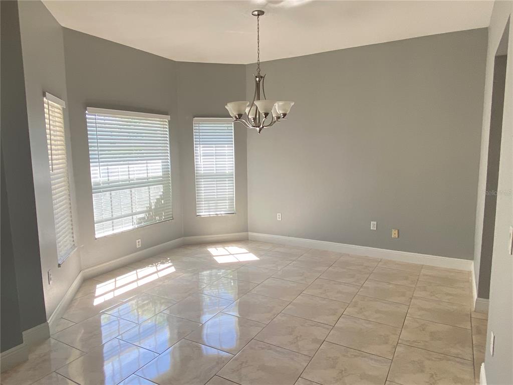 2467 Huron Circle Kissimmee, FL 34746 - Photo 3 of 26 a view of an empty room with a window