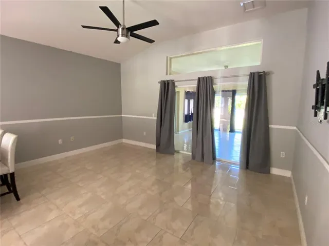 a view of livingroom with furniture and window