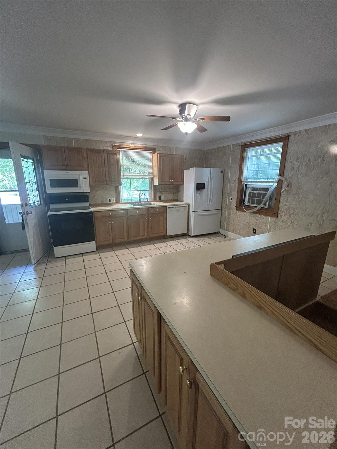 2051 Sutton Spring Road York, SC 29745 - Photo 21 of 47 a kitchen with stainless steel appliances a sink stove and cabinets