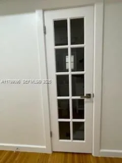 a bathroom with a granite countertop toilet a sink and a mirror