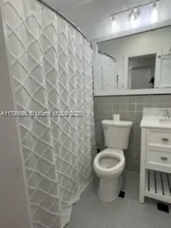 a bathroom with a toilet and a sink