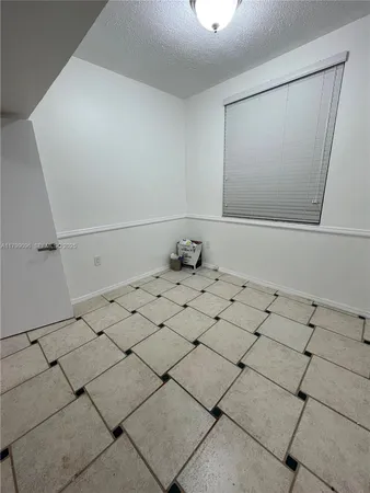 a bathroom with a toilet a sink and shower