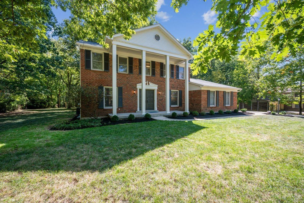 The exterior’s fresh paint in soft grays and warm beige tones, creates a modern look. Professional landscaping with low-maintenance perennials, and the walkway is neatly trimmed for a clean appearance.